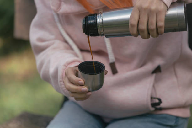 Hot black coffee in vacuum bottle thermos