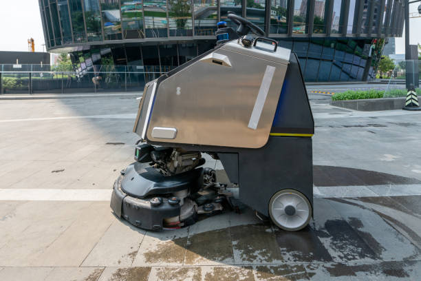 istock Automatic clean machine mopping outside of modern office building. 1424994174