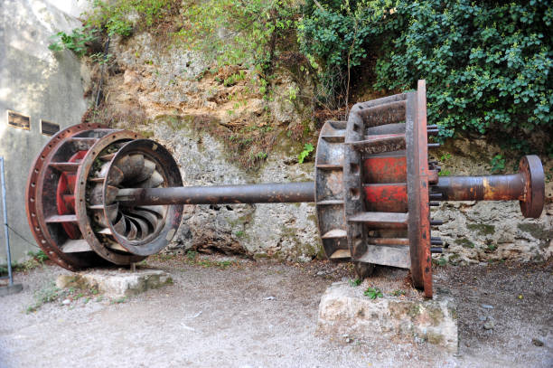 Water wheel in the park. Hydropower and kinetic generator. A mechanism with a rotating motion that converts water energy into energy.