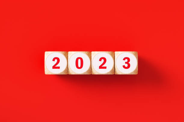 istock 2023 Written Wood Blocks Sitting on Red Background 1424999818