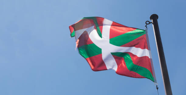 istock Basque country flag waving on blue background 1425003660