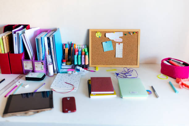 istock Office supplies on messy desk 1425005687
