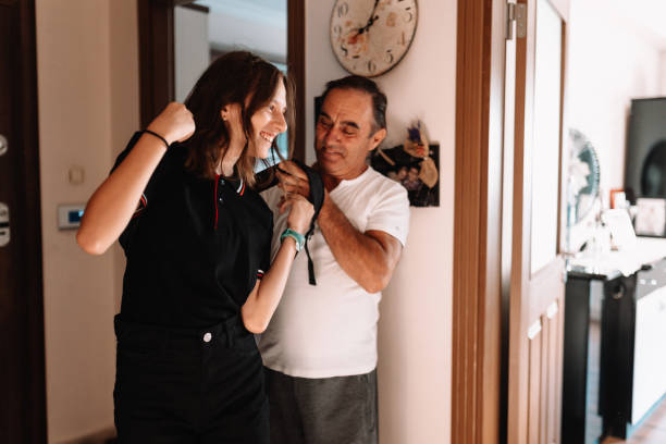 istock father sending his daughter to school 1425007100