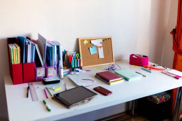 istock Office supplies on messy desk 1425007154
