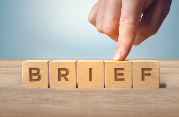 Brief word written with wooden cubes stock photo