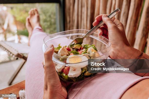 Healthy Young Woman Eating A Fresh Salad For Lunch Stock Photo - Download Image Now - Plastic Container, Protein, Salad