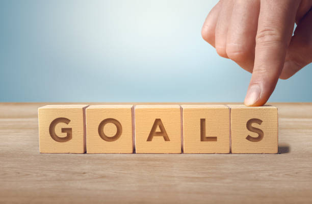 istock Goals word written with wooden cubes. Completion and goals concept. 1425013555