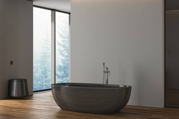 istock Side view on dark bathroom interior with bathtub, panoramic window in reflection, grey walls and parquet floor. 3d rendering 1425013886