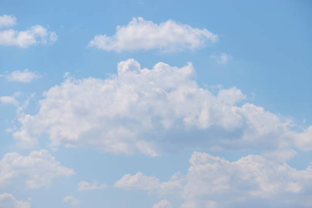 istock Pastel blue sky with fluffy clouds as a tranquil background 1425014762