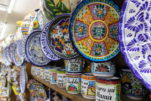 pattern of variety of pottery mexican talvaera ceramica colorful traditional dishes at a tradicional souvenir shop