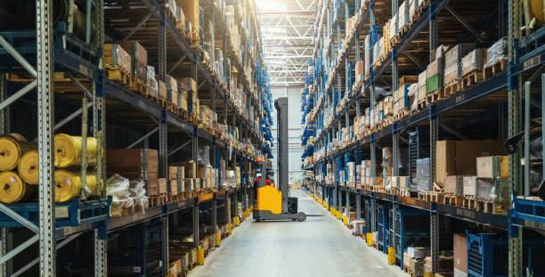 istock Modern distribution warehouse interior with many goods in boxes on shelves 1425027263