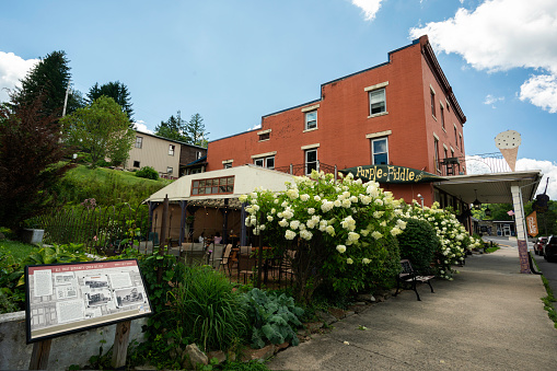 West Virginia, USA - August 12, 2022: Street view of the Purple Fiddle restaurant where live music plays nightly in the tiny mountain village of Thomas.
