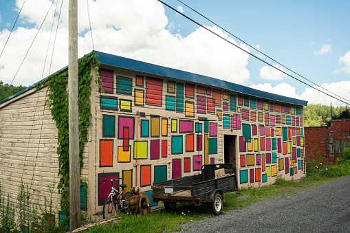 West Virginia, USA - August 12, 2022: Street view of a colorful painted shed along main street in the tiny mountain village of Thomas.