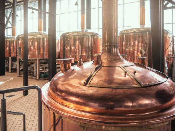 istock Brewery equipment. Brew manufacturing. Round cooper storage tanks for beer fermentation and maturation 1425033867