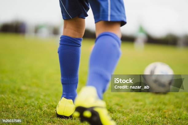 Boy Kicking Soccer Ball Stock Photo - Download Image Now - Soccer, Close-up, Boys