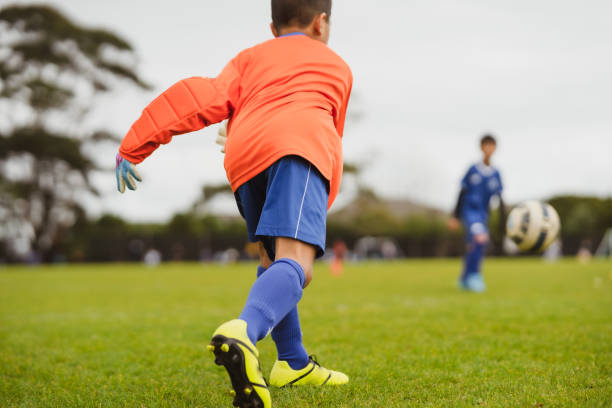 istock Goalkeeper throwing the ball while playing soccer. 1425037614