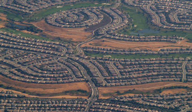 istock Aerial View Of Suburb Houses With Golf Course 1425041242