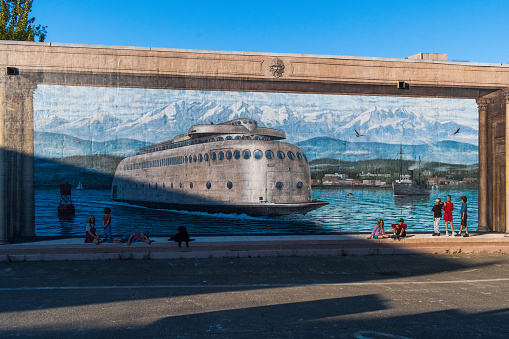 Port Angeles, WA \\ USA - 1 August 2022: A beautiful mural depicting the ferry MV Kalakala and people enjoying the waterfront