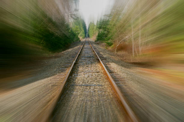 istock Motion blur zoom down the railroad track through the Oregon forest 1425042551