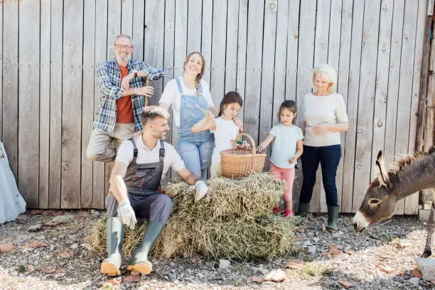 Photo of Portrait of a happy family on their farm