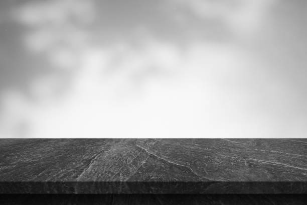 Marble table with tree shadow drop on white wall background for mockup product display