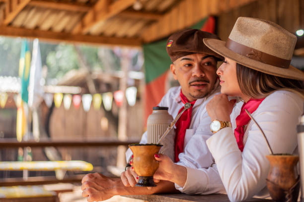 istock Gaucho couple drinking chimarrao at the farroupilha camp 1425048703