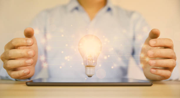istock businessman holding a light bulb graphic Digital technology abstract. imagine an idea Creative and innovative. brain to brainstorm ideas in business. Strategies for development, growth, and success 1425051066