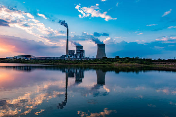 istock Nuclear power plant after sunset. Dusk landscape with big chimneys. 1425053769