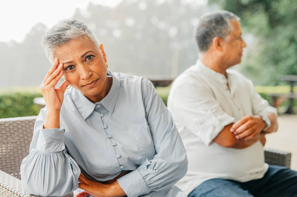 Thinking senior couple, sad about divorce and angry after fight in retirement in garden at home. Face portrait of elderly woman with depression, burnout and anxiety with marriage problem with man Thinking senior couple, sad about divorce and angry after fight in retirement in garden at home. Face portrait of elderly woman with depression, burnout and anxiety with marriage problem with man woman defeat stock pictures, royalty-free photos & images