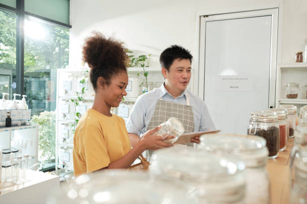 istock A shopkeeper and customer in refill store, zero-waste, and plastic-free grocery. 1425063435