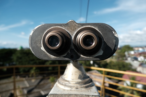 Banda Aceh, Indonesia - August 19, 2022 : The old ship's binoculars that can be used after we put a coin in it are photographed up close