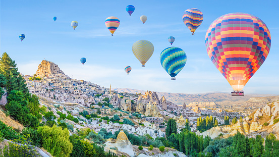 Air balloon at sunrise over the beautiful landscape in Kapadokya, Turkey