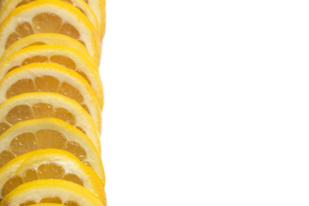 Two juicy slices of fresh lemon isolated on white background