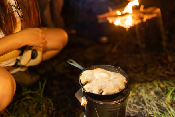 istock Cooking a huge shiitake mushroom on a cast iron skillet over camp fire 1425081009
