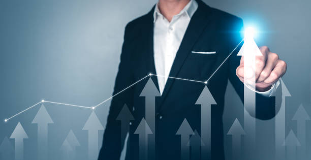 istock Businessman pointing arrow graph corporate future growth plan. Business development to success and growing concept. 1425084533