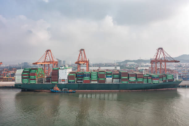 istock Large cargo ships are loading and unloading containers at the port in foggy weather 1425084756