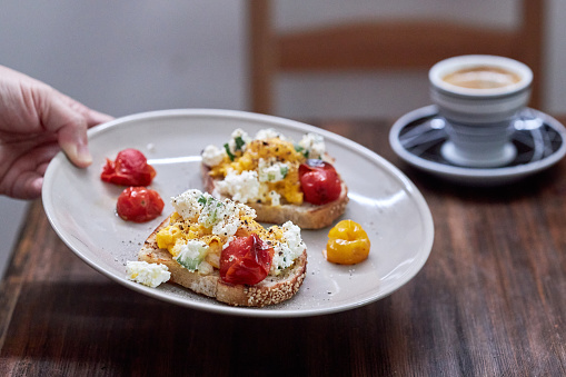 Delicious Brunch Toast: smashed egg, tomato and cheese