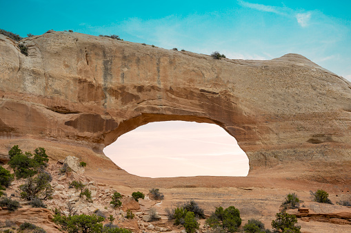 Beautiful landscape with orange color sandstone and famous Wilson Arch in Utah