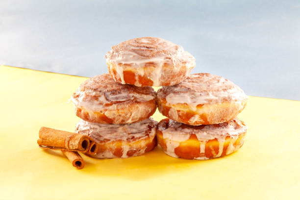 istock Cinnamon hand made brioche doughnuts piled up on top of one another. 1425092299
