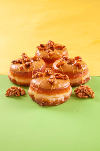 istock Walnut flavoured caramelised gourmet brioche doughnuts. 1425092363
