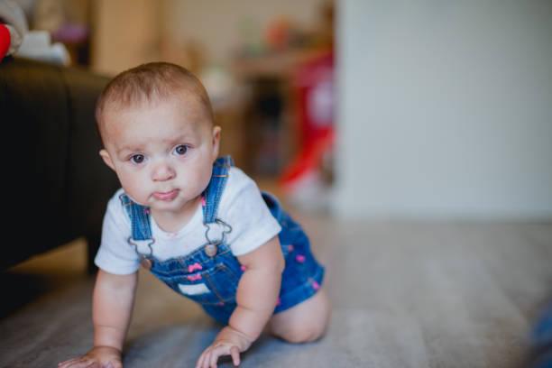istock Cute Baby Girl Laughing and Playing 1425093676