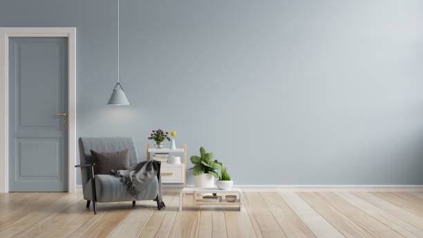 istock Living room has a armchair on empty blue color wall background. 1425095654