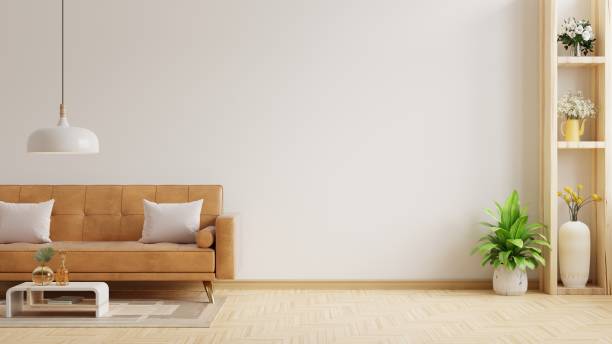 Living room wall mock up with leather sofa and decor on white background.