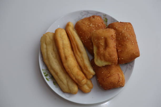istock Spring rolls are a light and refreshing traditional egg roll dish. This delicious appetizer is stuffed with bamboo shoots to make a flavorful filling. deep fried dough stick on white background 1425096718