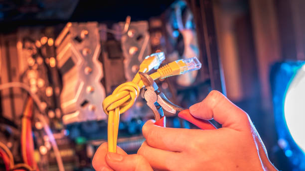 istock Cutting the Internet cable tied into a knot with wire cutters. Disconnecting the Internet and restricting access. 1425098799