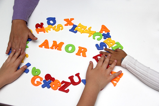 Children's game of colored letters form the word 