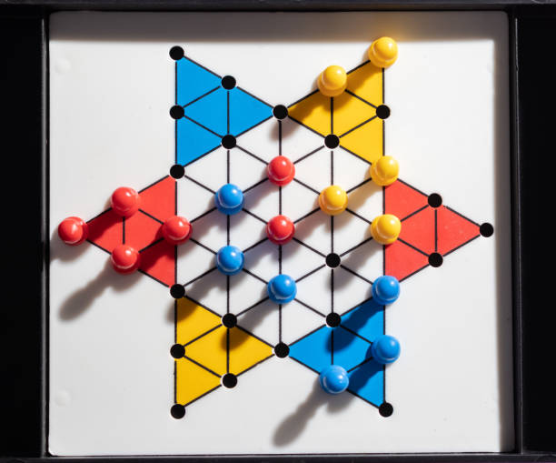Chinese checker board game Top view on a chinese checker indoor game board chinese checkers stock pictures, royalty-free photos & images