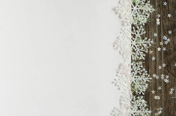 White winter background with snowflakes and wood