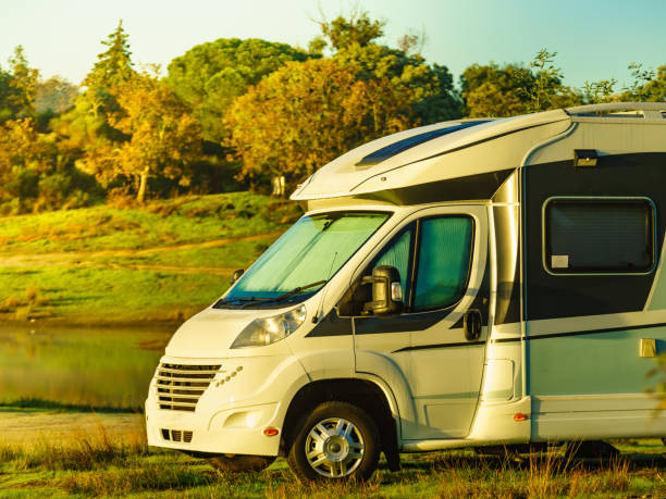 istock Rv caravan on lake shore. Autumn time. 1425104378