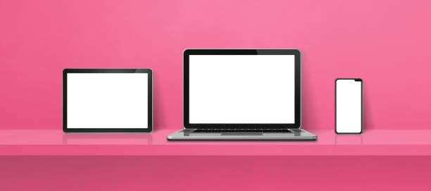 istock Laptop, mobile phone and digital tablet pc on pink wall shelf. Banner background 1425109844